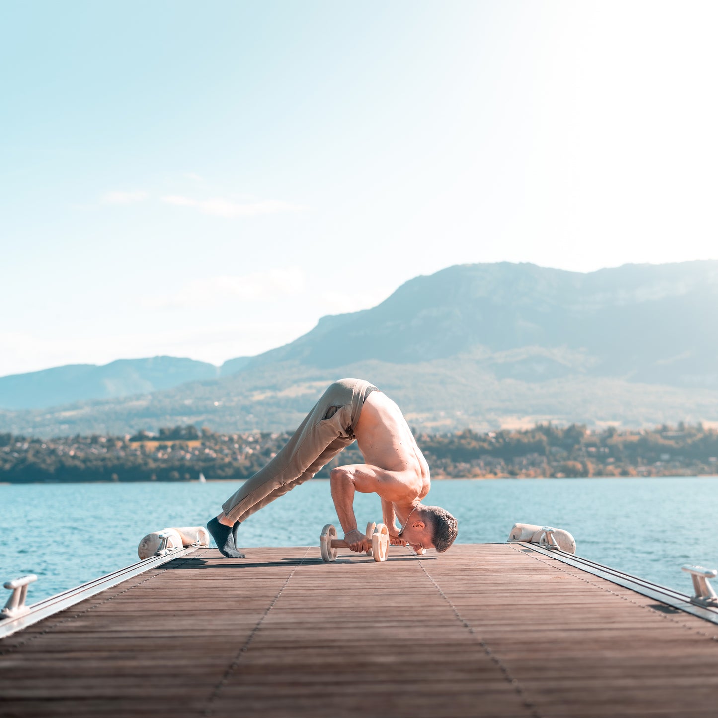 Wooden dumbbell parallettes in use - bodyweight training demonstration