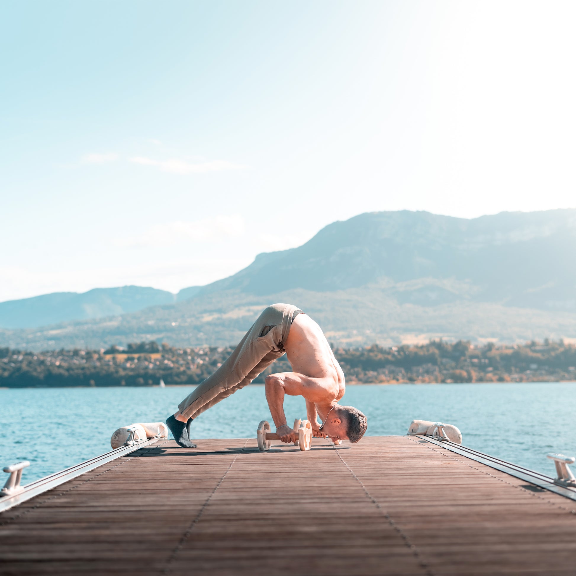 Wooden dumbbell parallettes in use - bodyweight training demonstration