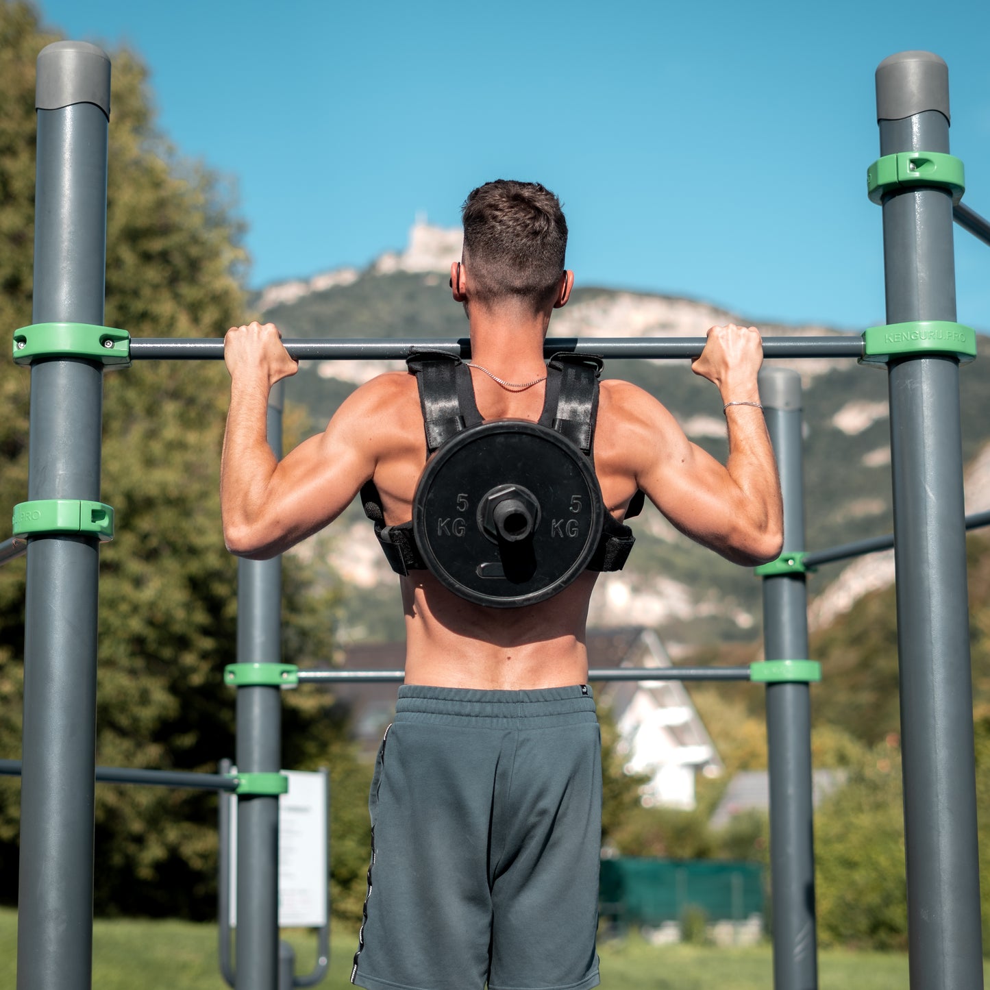 Black weighted vest plate carrier in use - CrossFit training demonstration