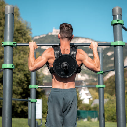 Black weighted vest plate carrier in use - CrossFit training demonstration