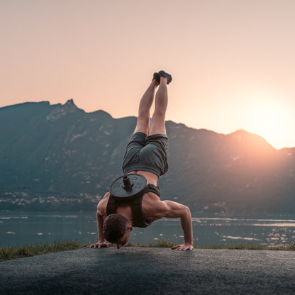 Army green weighted vest plate carrier in use - strength training demonstration